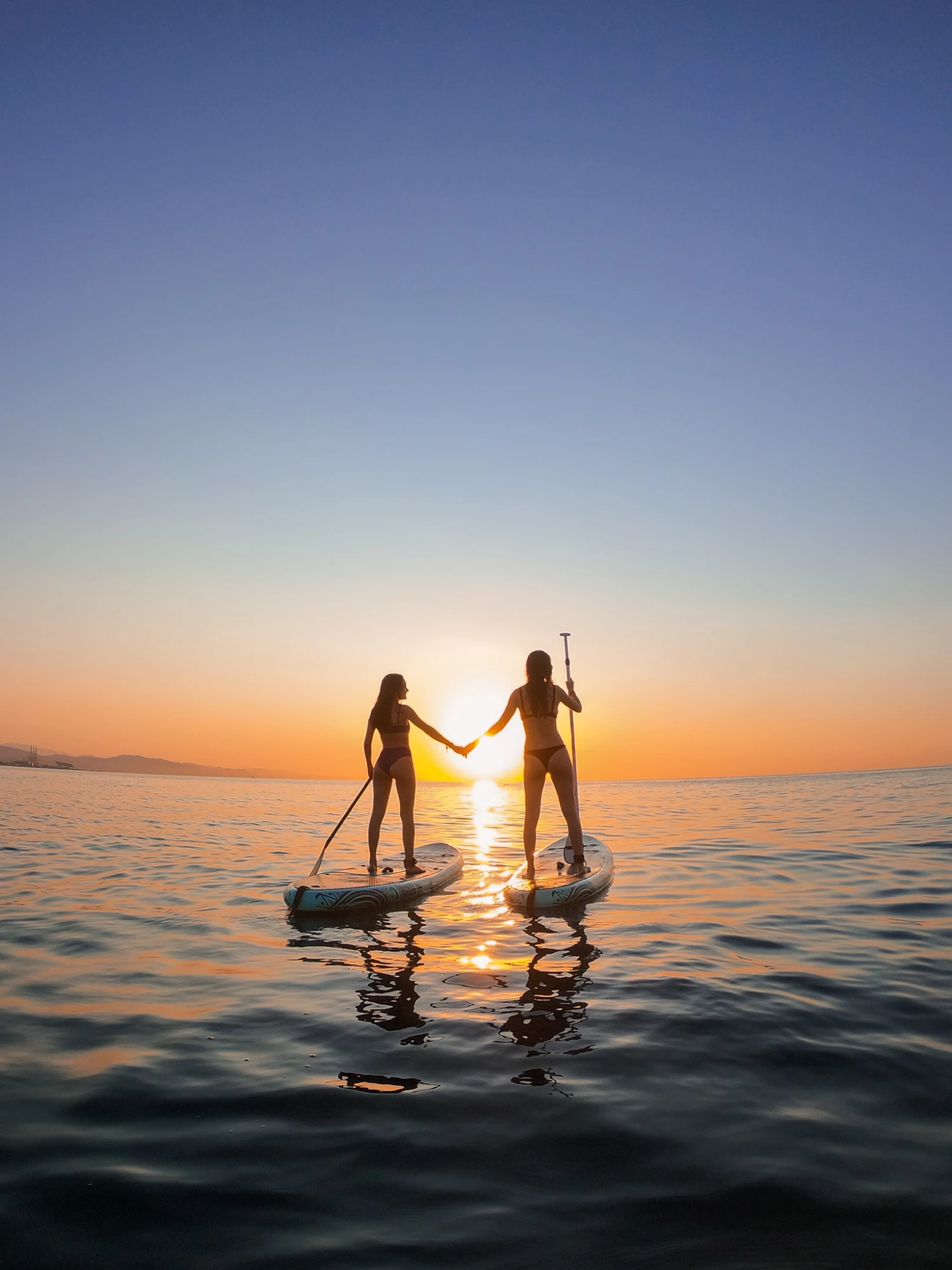 Sunrise paddle boarding, hand in hand, Konyaaltı beach Antalya