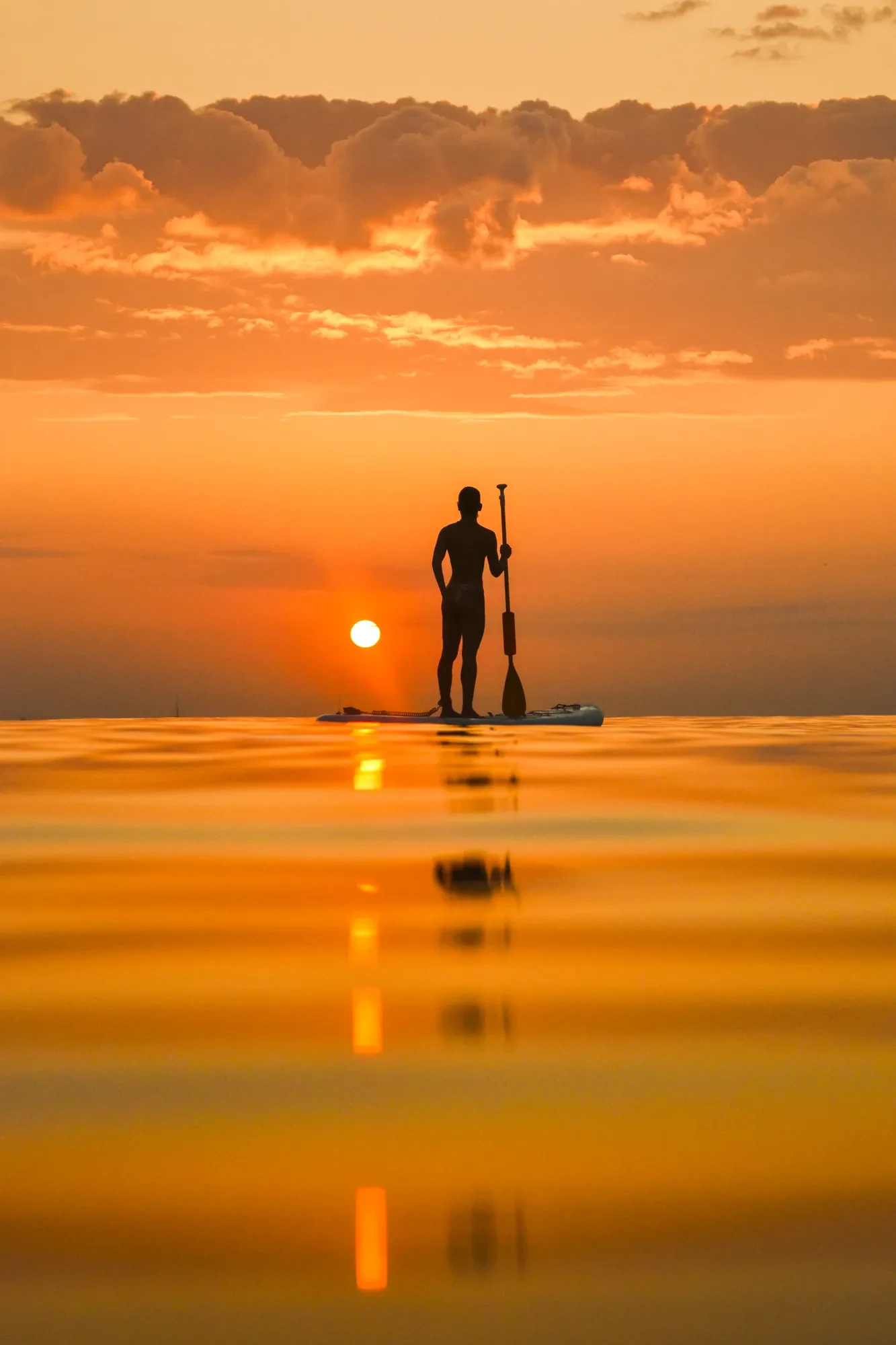Solo SUP paddle boarder at sunrise in Antalya